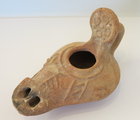 A LARGE BYZANTINE TERRACOTTA OIL LAMP
