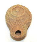 AN EARLY SAMARITAN TERRACOTTA OIL LAMP WITH SEALED DISCUS