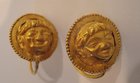 A PAIR OF LATE HELLENISTIC GOLD EARRINGS WITH FACE OF EROS