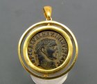 A ROMAN BRONZE FOLLIS OF MAXIMINUS II IN 22K GOLD FILLED PENDANT