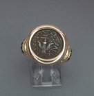A WIDOWS MITE SET IN 18K GOLD RING WITH BLACK DIAMONDS
