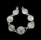 SEVEN ROMAN SILVER DENARII OF THE 2ND AND 3RD CENTURIES IN BRACELET