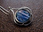 A ROMAN GLASS FRAGMENT SET IN STERLING SILVER PENDANT