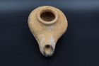 A HELLENISTIC TERRACOTTA OIL LAMP
