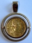 A BYZANTINE GOLD SOLIDUS IN 18K GOLD SETTING