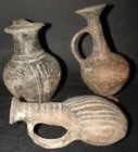 THREE CYPRIOT POTTERY FLASKS