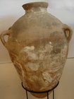 A LARGE CANAANITE TERRACOTTA FOUR HANDLE AMPHORA