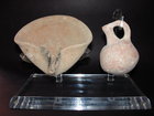 A TERRACOTTA OIL LAMP AND JUGLET FROM THE HOLY LAND