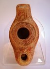 A BYZANTINE CLAY OIL LAMP FROM ANTIOCH