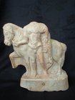 A GREEK MARBLE FIGURE OF A HORSE AND DISMOUNTED RIDER