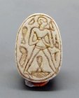 A HYKSOS PERIOD STEATITE SCARAB WITH HUMAN FIGURE