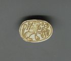 A HYKSOS PERIOD STEATITE SCARAB WITH LION AND CAPTIVE
