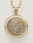 A SILVER TETRADRACHM OF ALEXANDER THE GREAT IN 14K GOLD PENDANT