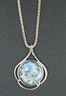 A ROMAN GLASS FRAGMENT SET IN STERLING SILVER PENDANT